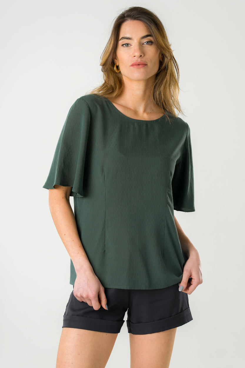 Blouse verte en Tencel éco-responsable, manches amples et coupe fluide, fabriquée au Portugal.